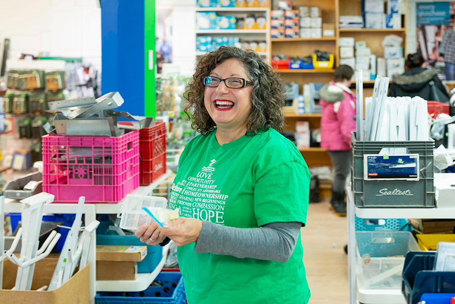 A smiling Habitat Greater Ottawa Volunteer at one of our ReStore locations.