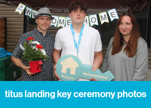 Habitat Partner Family and their child holding flowers and novelty blue key during the Titus Landing Key Ceremony. Text at the bottom of the image reads, "Titus Landing Key Ceremony photos".